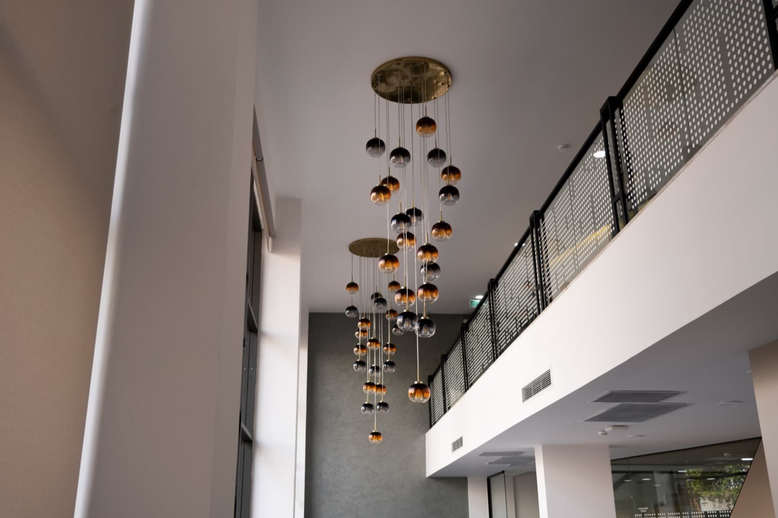 Clinic hallway with designer pendant lighting